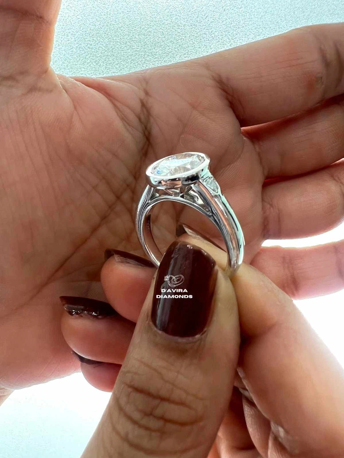Lab Grown Oval Engagement Ring in Bezel Setting Three Stone style
