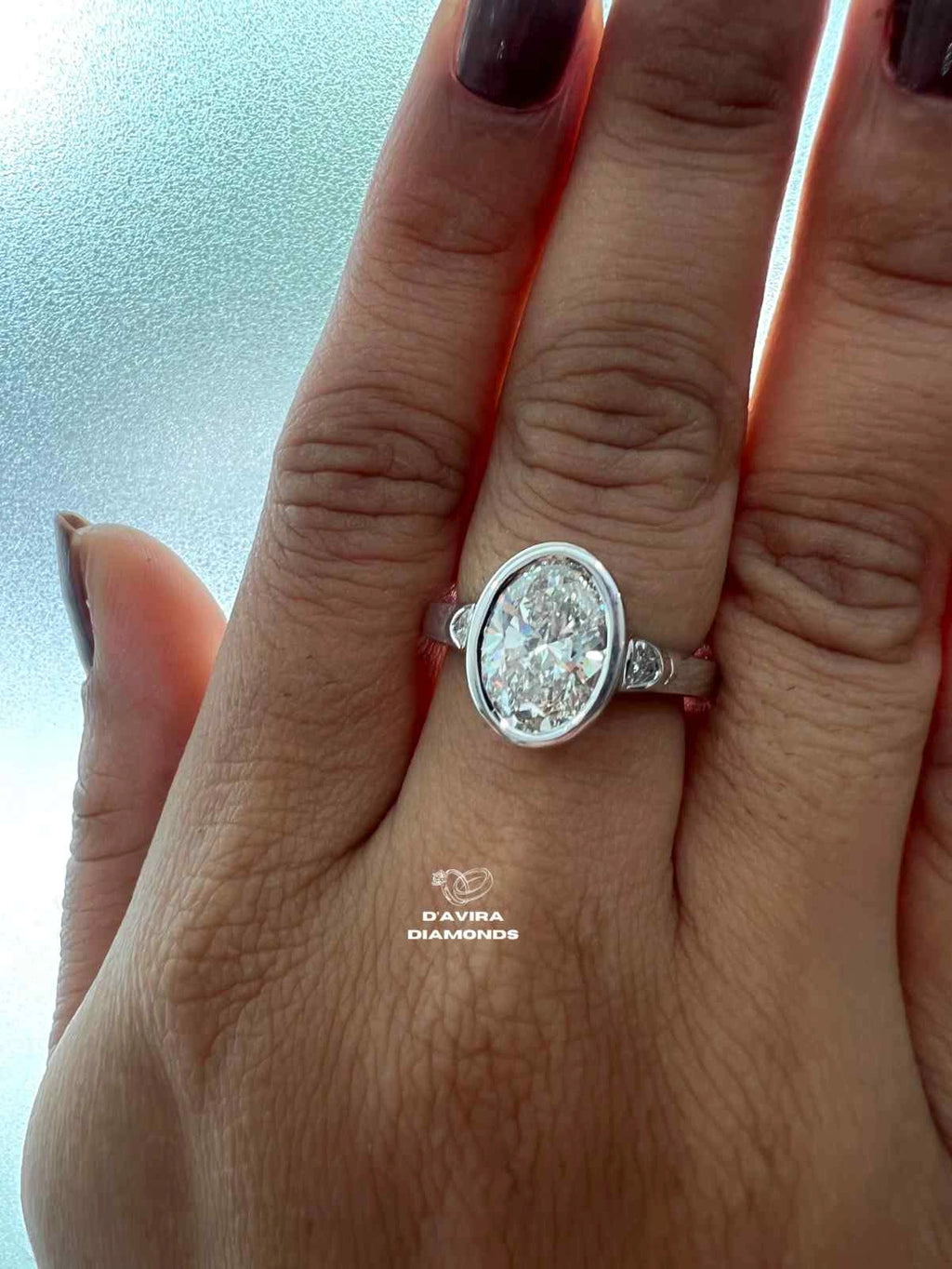 Lab Grown Oval Engagement Ring in Bezel Setting Three Stone style
