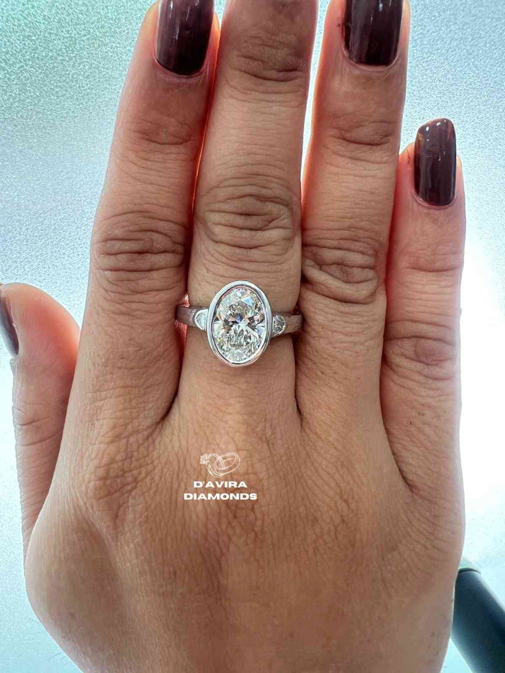 Lab Grown Oval Engagement Ring in Bezel Setting Three Stone style