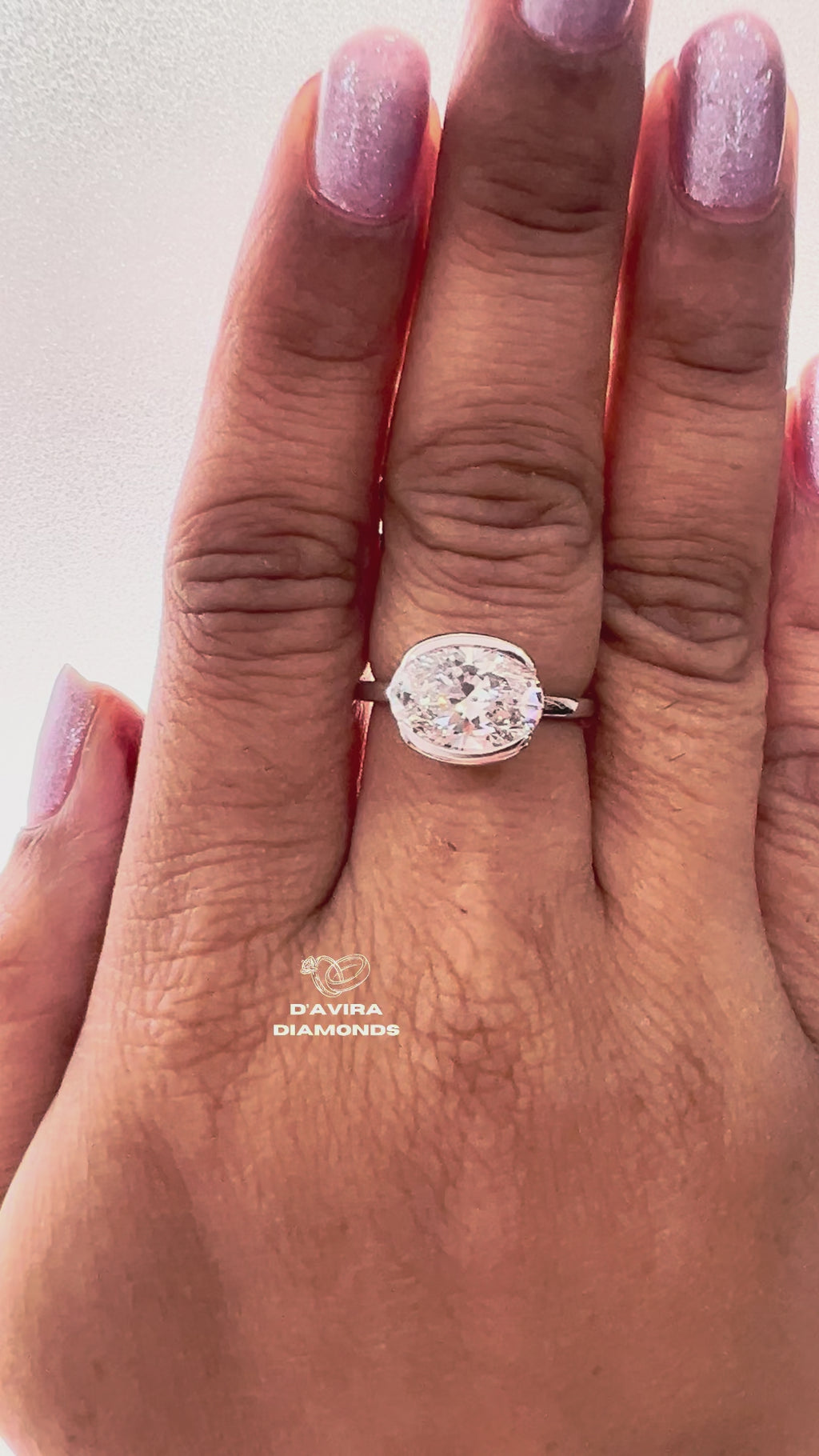East West Oval Cut Half Bezel Set Diamond Ring