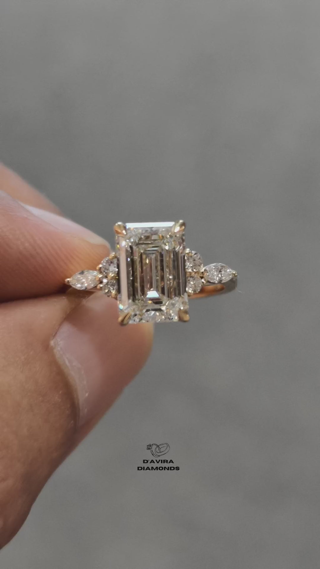 video of  Emerald cut diamond engagement ring with marquise and round side stones