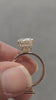 video of  front view of the  yellow gold double hidden halo ring featuring a large round-cut center