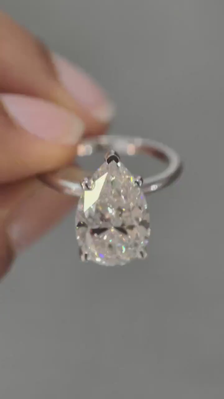video of Pear Cut Solitaire Hidden Halo Set Ring For Her