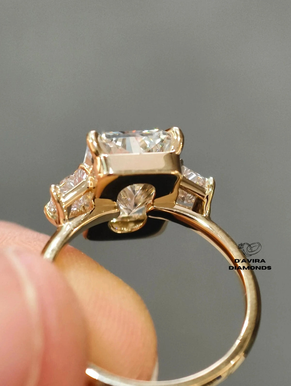 three-stone diamond engagement ring with radiant cut center stone