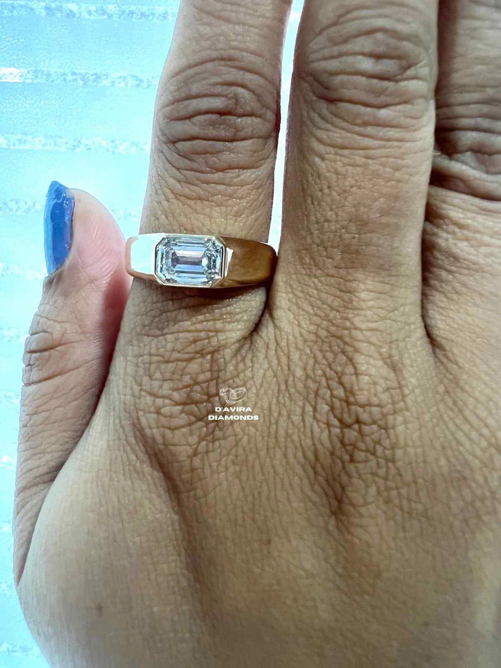 Yellow Gold Band emerald cut lab grown diamond solitaire on finger