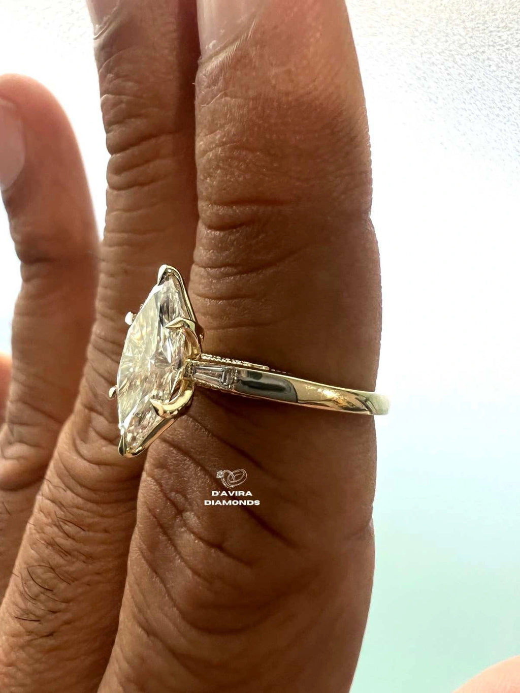 A close-up of a 3 stone lab diamond wedding ring for wife