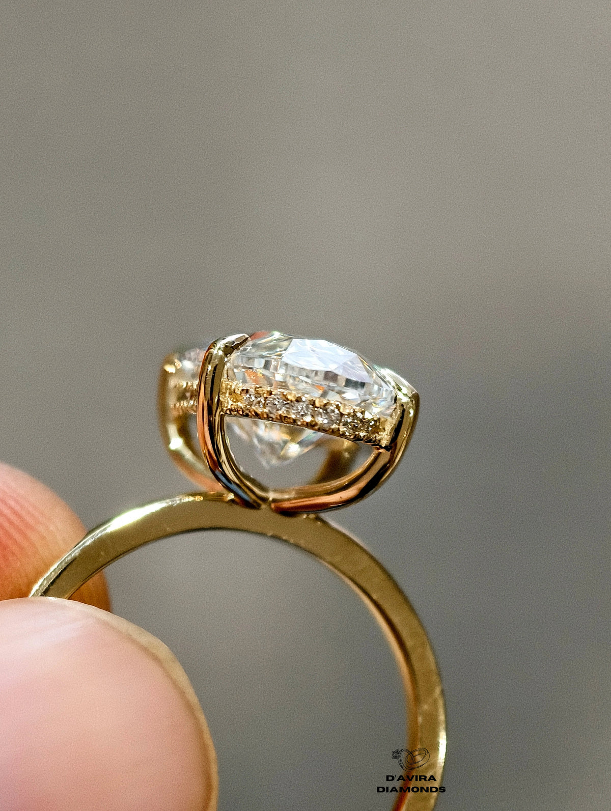gold band and a hidden diamond pave halo basket setting.