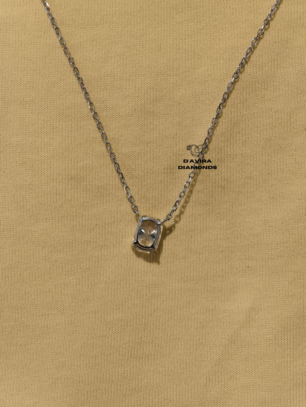 hand wearing a delicate silver chain necklace 