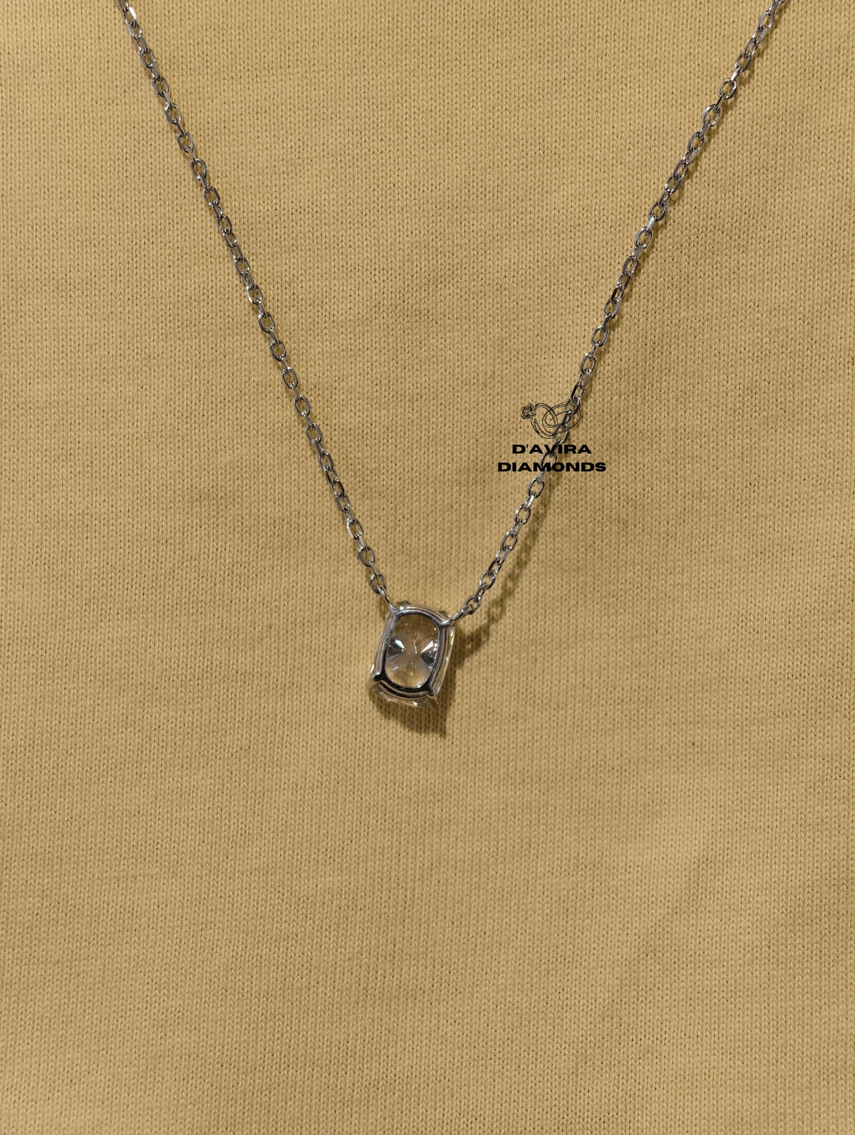 hand wearing a delicate silver chain necklace 