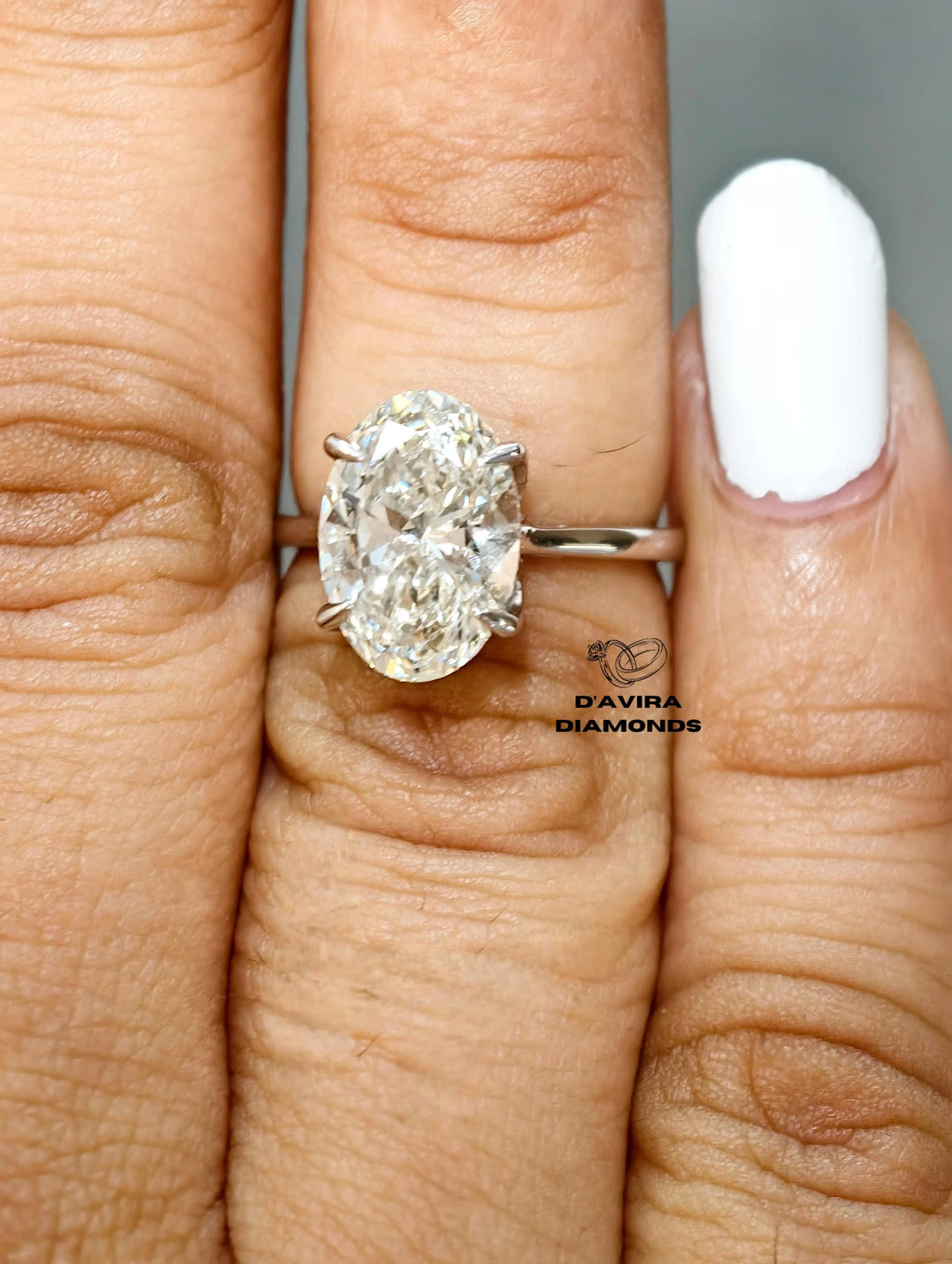 Lab grown diamond ring with wide white gold band close up