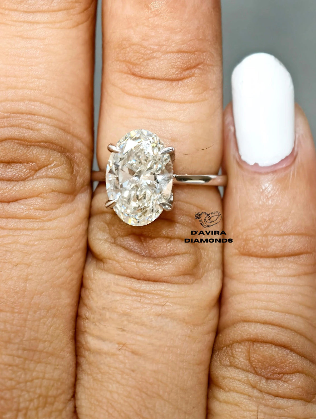 Lab grown diamond ring with wide white gold band close up