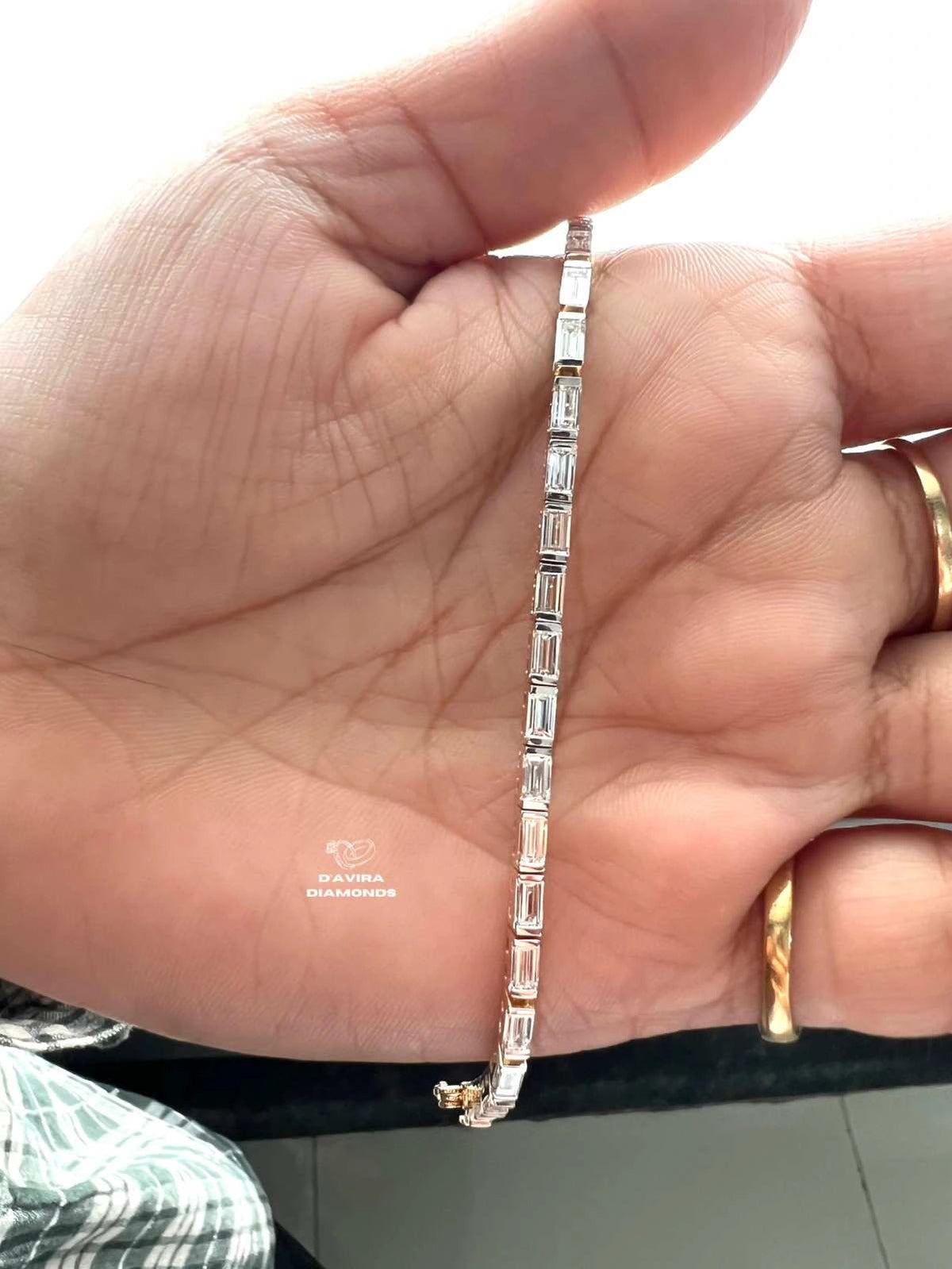 front view Emerald cut tennis bracelet worn on wrist