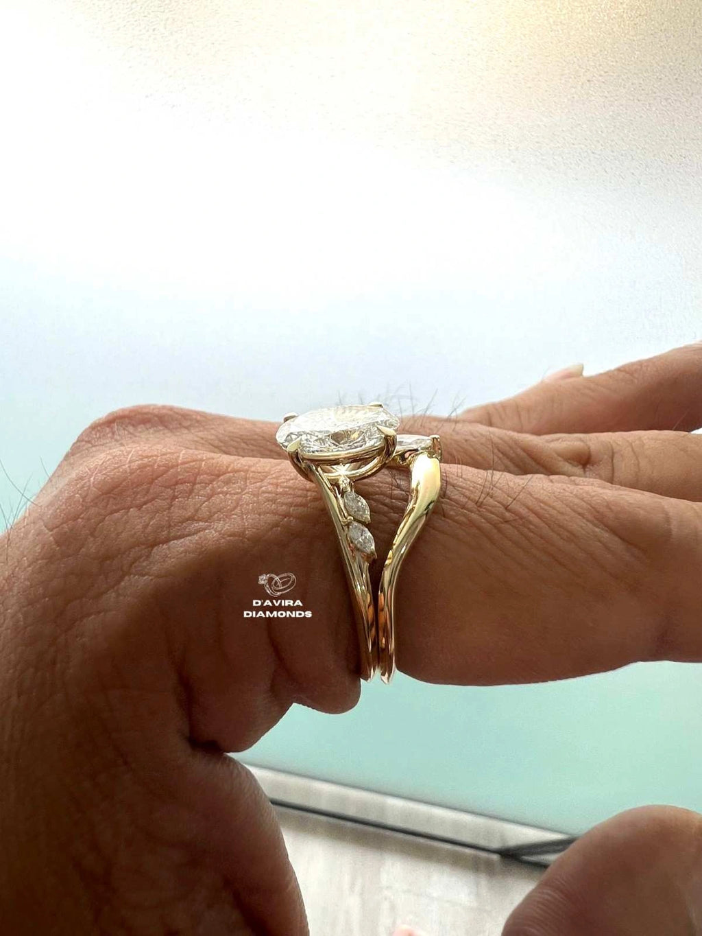 Side view of an oval cut lab grown diamond wedding ring